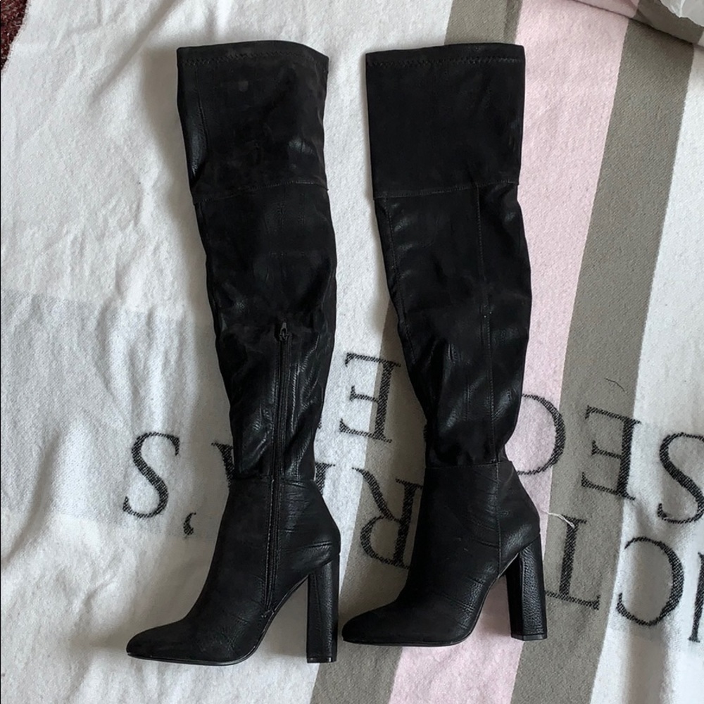 Over the knee black suede boots with a block heel